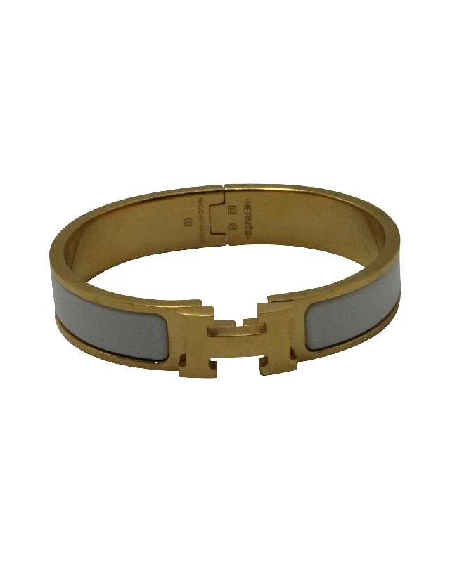 Shop Fine Jewelry With Exclusive Savings Hermès Enamel Clic Clac H Bracelet in Gold Metal Shop Fine Jewelry With Exclusive Savings Hermès Enamel Clic Clac H Bracelet in Gold Metal
